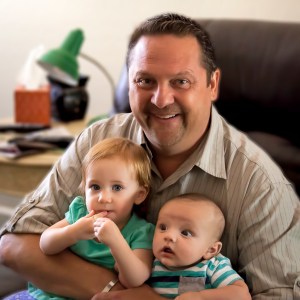 Greg With Two of His Grand Children; photograph by Mary Gilstrap